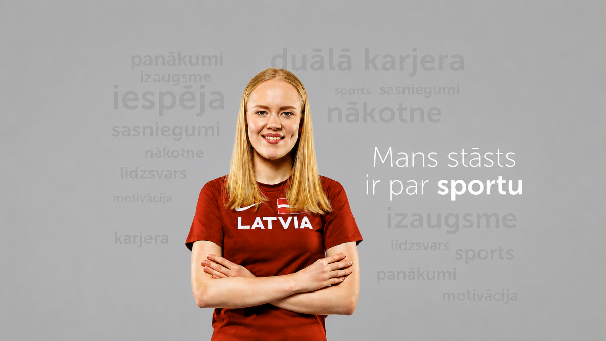 Persona Latvijas izlases sporta kreklā ar uzrakstu “LATVIA” stāv sakrustotām rokām uz pelēka fona. Attēlā redzams teksts “Mans stāsts ir par sportu un izaugsmi”, bet fonā izvietoti atslēgvārdi “duālā karjera”, “iespēja”, “nākotne”, “sasniegumi”, “karjera”, “motivācija”, “līdzsvars” un “sports”. Attēls akcentē sporta un izglītības līdzsvaru personīgajā izaugsmē un nākotnes karjerā.