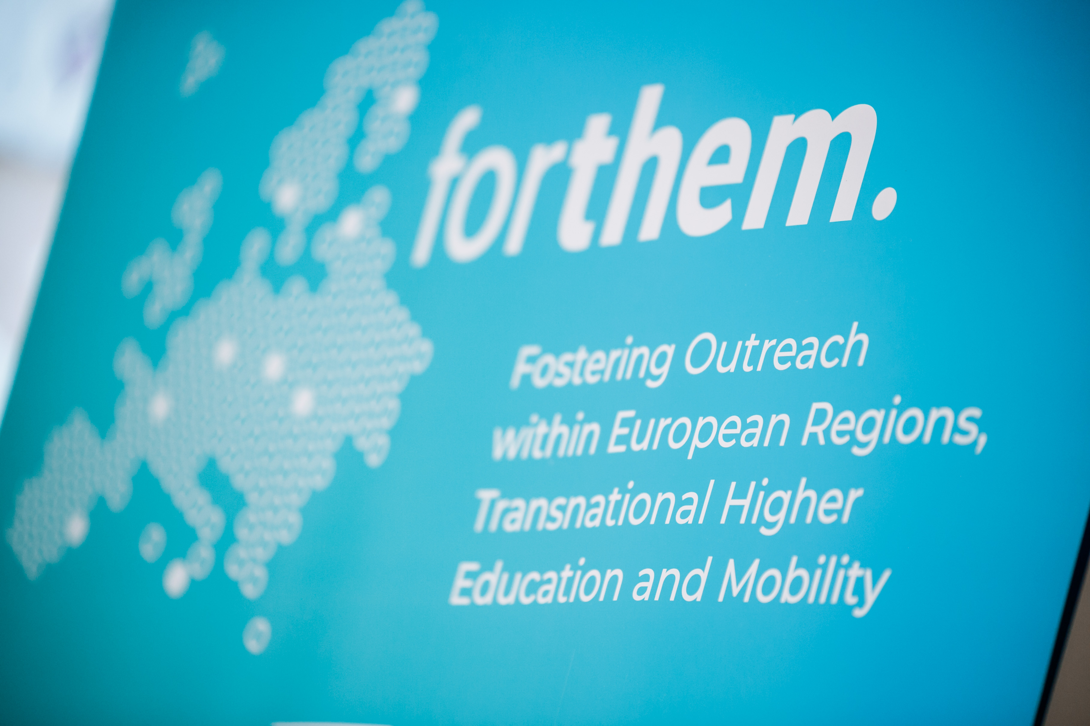 FORTHEM programme banner displaying the name "Fostering Outreach within European Regions, Transnational Higher Education and Mobility." A dotted outline of the European map and the "forthem." logo are shown on a teal blue background.